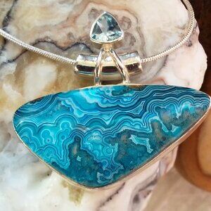 NWOTBeautiful Blue Laquana Lace and Blue Topaz Necklace Sterling Silver Setting.